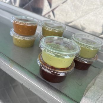 La Cascada - a variety of condiments on a counter - Food Trucks Near Me La Cascada - a variety of condiments on a counter - Food Trucks Near Me