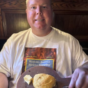 Muldoon's Irish Pub - Michael Russell with soda bread - Irish Pub Near Me - Newport Beach, California Muldoon's Irish Pub - Michael Russell with soda bread - Irish Pub Near Me - Newport Beach, California