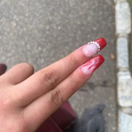 Jewels not even b under them bloody on cuticle flames is horrific smudged by lady who did nails
