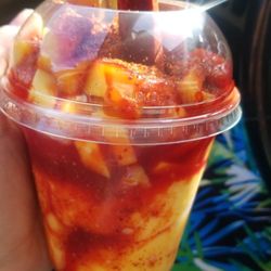 Antojitos Majicos - Mangonada. Mango ice cream, fruit chunks, Chile, and Chaney make this a summer treat.