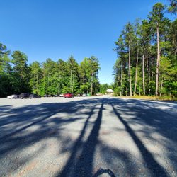 Lavender Oaks Farm - Gravel parking lot and your walk to the white building on the far side.