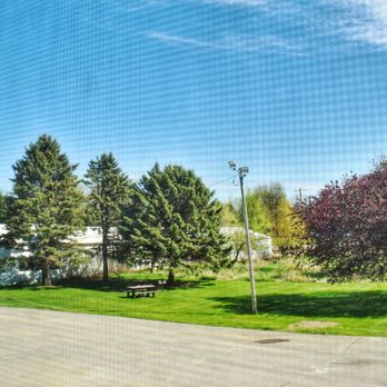 Hampton Motel - Our back yard area with picnic tables, charcoal grills, and plenty of room to let the doggo's roam around. - Hotels Near Me - Hampton, Iowa