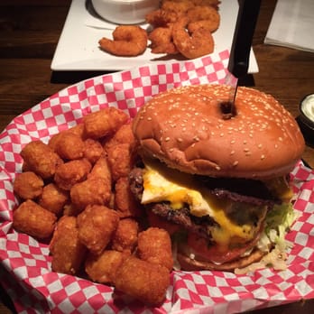 Dundee's Bar and Grill - Monster burger with an egg added and coconut shrimp! - Breakfast & Brunch Near Me - Seaside, Oregon Dundee's Bar and Grill - Monster burger with an egg added and coconut shrimp! - Breakfast & Brunch Near Me - Seaside, Oregon