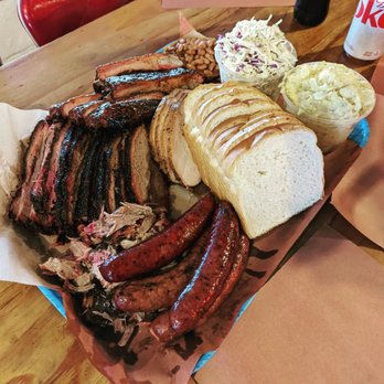 Franklin Barbecue - Brisket, pulled pork, sausage links (regular and spicy), potato salad, slaw, beans, ribs, and a little turkey in the middle. - Barbeque Near Me - Austin, Texas Franklin Barbecue - Brisket, pulled pork, sausage links (regular and spicy), potato salad, slaw, beans, ribs, and a little turkey in the middle. - Barbeque Near Me - Austin, Texas