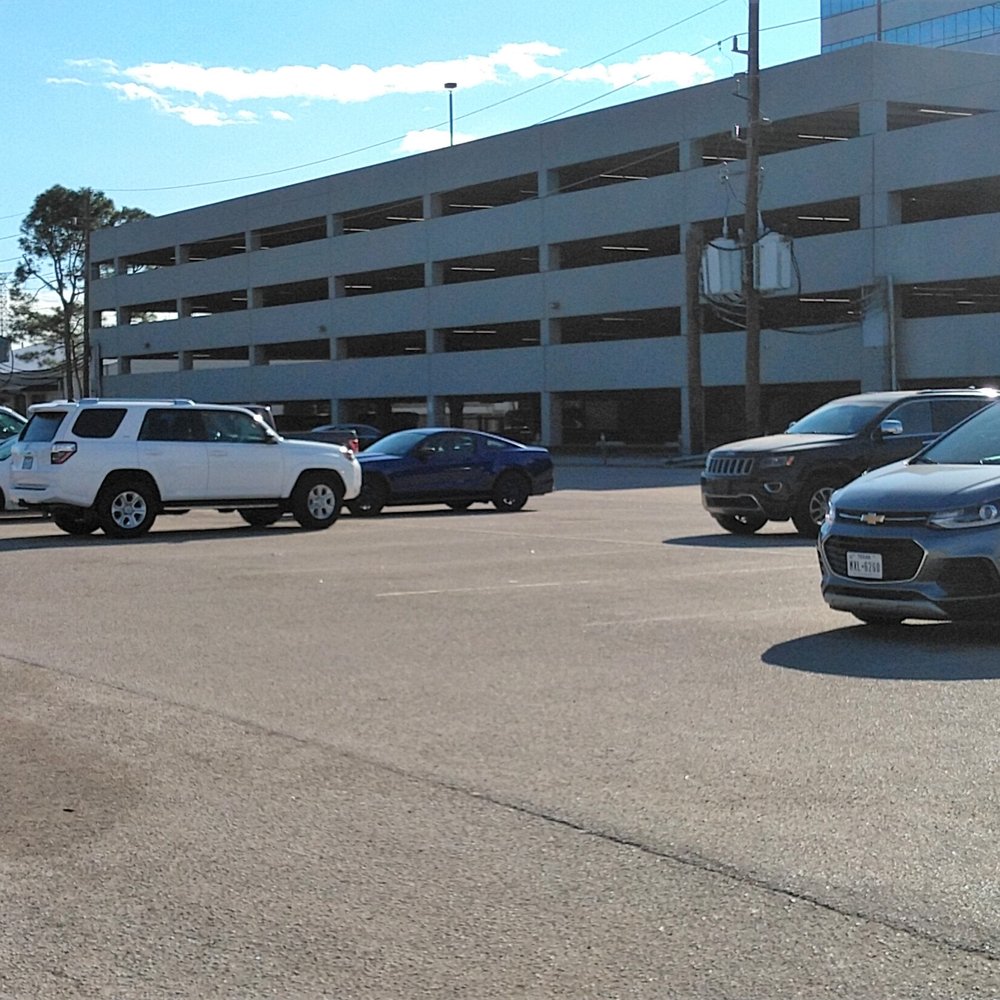This is the large parking lot for the dog park - wedged between the dog park and a parking structure for an office park type area.
