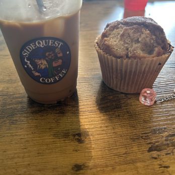 Sidequest Coffee - Medium ice latte with spiced brown sugar and pumpkin pie, an apple crunch muffin, and a dice key chain. - Coffee Roasteries Near Me - El Dorado Springs, Missouri Sidequest Coffee - Medium ice latte with spiced brown sugar and pumpkin pie, an apple crunch muffin, and a dice key chain. - Coffee Roasteries Near Me - El Dorado Springs, Missouri