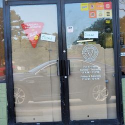 Front doors of Sal's with "Closed" sign and windows covered.