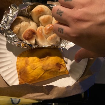 Villa Mia Pizza - a hand grabbing a piece of pizza from a paper plate - Pizza Near Me - Brooklyn, New York Villa Mia Pizza - a hand grabbing a piece of pizza from a paper plate - Pizza Near Me - Brooklyn, New York