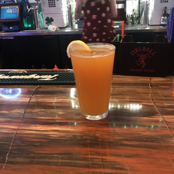 Lucky's Pub - a glass of orange juice on a bar - Sports Bars Near Me - Salem, Oregon