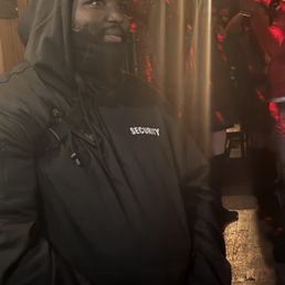 The security guard that is not allowing people in to close tabs.