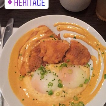 Heritage - Fried rockfish with cheesy grits, tomato aioli, and lightly poached eggs - New American Near Me - Richmond, Virginia Heritage - Fried rockfish with cheesy grits, tomato aioli, and lightly poached eggs - New American Near Me - Richmond, Virginia