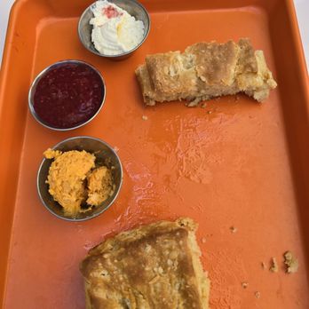 Smothered - Fresh baked buttermilk biscuits with red chile honey butter, reg butter and raspberry preserve - Breakfast & Brunch Near Me - Albuquerque, New Mexico