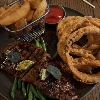 The Rabbit Hole - Steak & Chips (agf) $54 Soz wellington county strip loin steak, green beans, onion rings, marmite aïoli, red wine jus - Gastropubs Near Me - Toronto, Ontario
