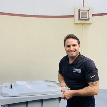 Future Shredding - Chad rolling a bin back to a client. - Shredding Services Near Me