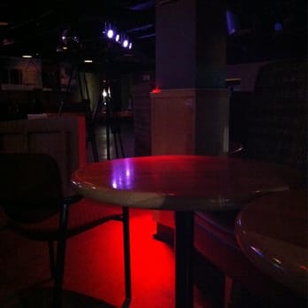 The Gateway - a table and chairs in a dimly lit room - Bars Near Me - Calgary, Alberta The Gateway - a table and chairs in a dimly lit room - Bars Near Me - Calgary, Alberta