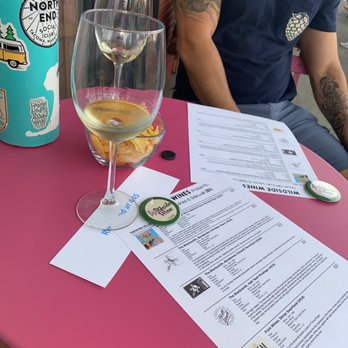 Wildside Wine - a man sitting at a table with a glass of wine - Beer, Wine & Spirits Near Me - Fircrest, Washington Wildside Wine - a man sitting at a table with a glass of wine - Beer, Wine & Spirits Near Me - Fircrest, Washington