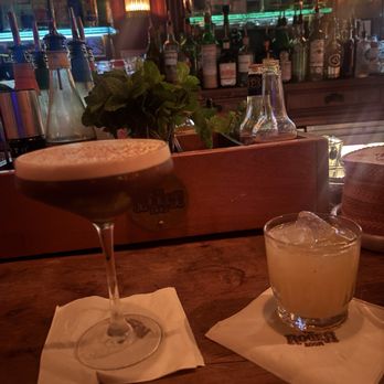 The Roger Room - Christmas Clarified Eggnog cocktail (right) & Black Dahlia (left) - Cocktail Bars Near Me - Los Angeles, California The Roger Room - Christmas Clarified Eggnog cocktail (right) & Black Dahlia (left) - Cocktail Bars Near Me - Los Angeles, California