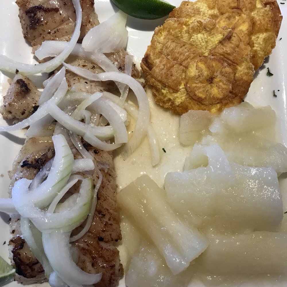 Grouper in a garlic sauce, yuca, and tostones. Grouper in a garlic sauce, yuca, and tostones.