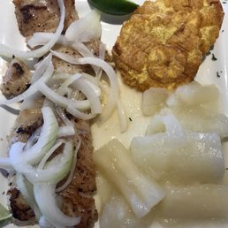Grouper in a garlic sauce, yuca, and tostones. Grouper in a garlic sauce, yuca, and tostones.
