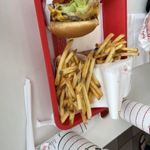 Photo of In-N-Out Burger - San Francisco, CA, United States. Cheeseburger animal style with chopped chili's. Well done fries and strawberry shake. Delicious!