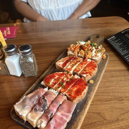 Prosciutto, fig, and mascarpone, sweet spicy pepper jam and goat cheese, Mexican street corn toasts