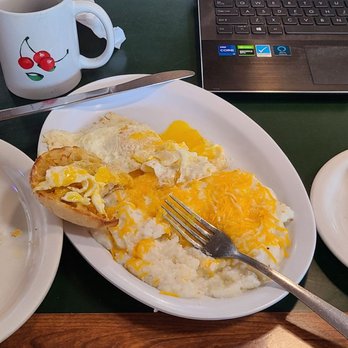 Cafe Perks - Country Fried Catfish w/ Eggs over medium, English muffin and cheese grits - American Near Me - Longwood, Florida