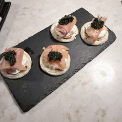 Caviar on salmon blini.