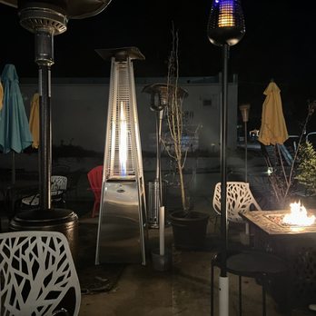 Nickelpoint Brewing - a patio with patio furniture and a firepit - Breweries Near Me - Raleigh, North Carolina