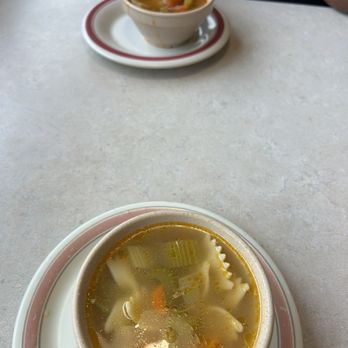 Southside Grill - a bowl of soup and a plate with a spoon - American Near Me - Warren, Michigan