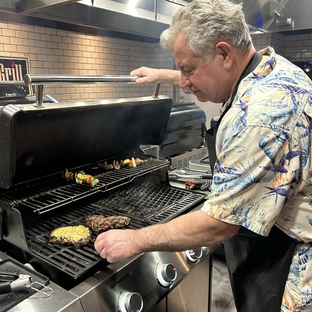 Weber Grill Cooking School - My husband grilling our steaks. One had a Parmesan crust. Yummy! - Cooking Schools Near Me - Lombard, Illinois Weber Grill Cooking School - My husband grilling our steaks. One had a Parmesan crust. Yummy! - Cooking Schools Near Me - Lombard, Illinois