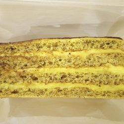 Lakomka Delicatessen - They sell cake by weight. It's a huge sheet and you tell them how big a piece you want. This was $9.30. Kinda expensive, IMO.
