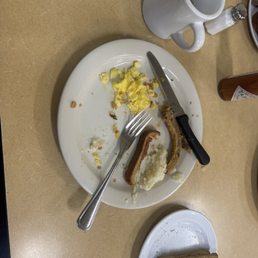 It was a Pork chop, scrambled eggs, grits, wheat toast and coffee
