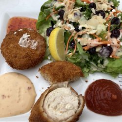 Tides Restaurant - Crab cakes (with 3 good sauces), a slice of the lobster-stuffed chicken, and delicious blueberry salad