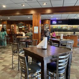 View if the bar and indoor seating area. View if the bar and indoor seating area.