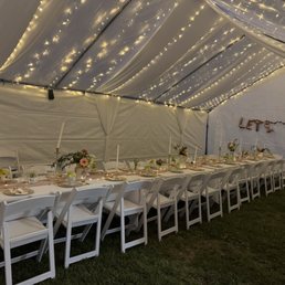 Tent, lights, tables, chairs, and table linens.