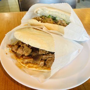Wild Ginger - A2. Spicy Cumin Lamb Burger A1. Stewed Pork Burger (back) - Chinese Near Me - Alameda, California Wild Ginger - A2. Spicy Cumin Lamb Burger A1. Stewed Pork Burger (back) - Chinese Near Me - Alameda, California