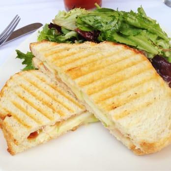 Cheesetique - Brie, apple and prosciutto grilled cheese sandwich with a side of greens. Yum! - Cheese Shops Near Me - Alexandria, Virginia