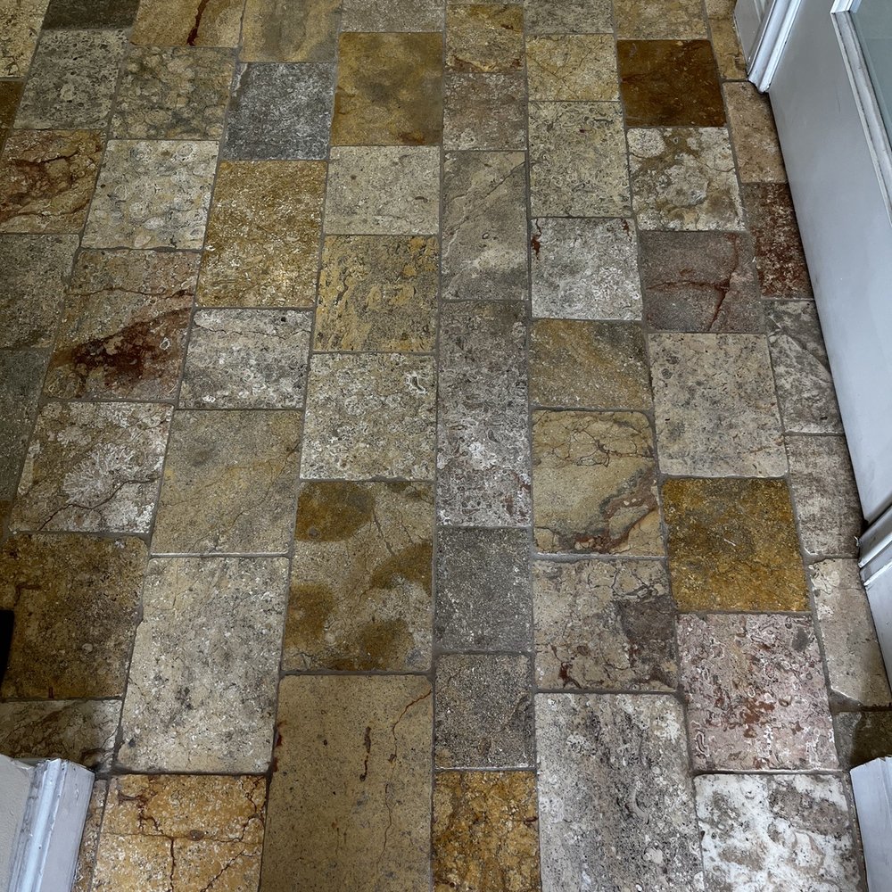 LA Stone Care - a tiled floor with a white door - Flooring Near Me
