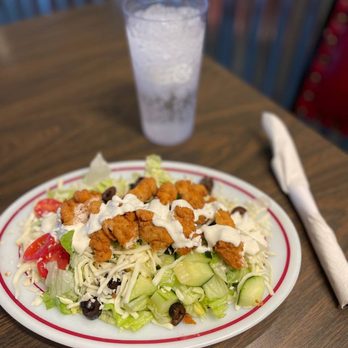 Dinos Pizza & Steakhouse - a plate of salad and a glass of water - Pizza Near Me - Washington, Iowa Dinos Pizza & Steakhouse - a plate of salad and a glass of water - Pizza Near Me - Washington, Iowa