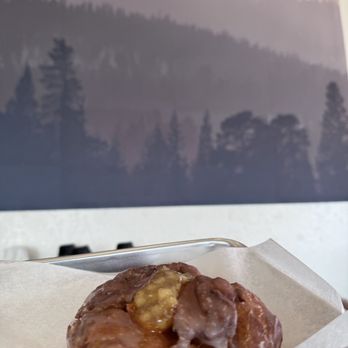 Crafted Dough - a half eaten donut on a tray - Donuts Near Me - Murphy, North Carolina Crafted Dough - a half eaten donut on a tray - Donuts Near Me - Murphy, North Carolina