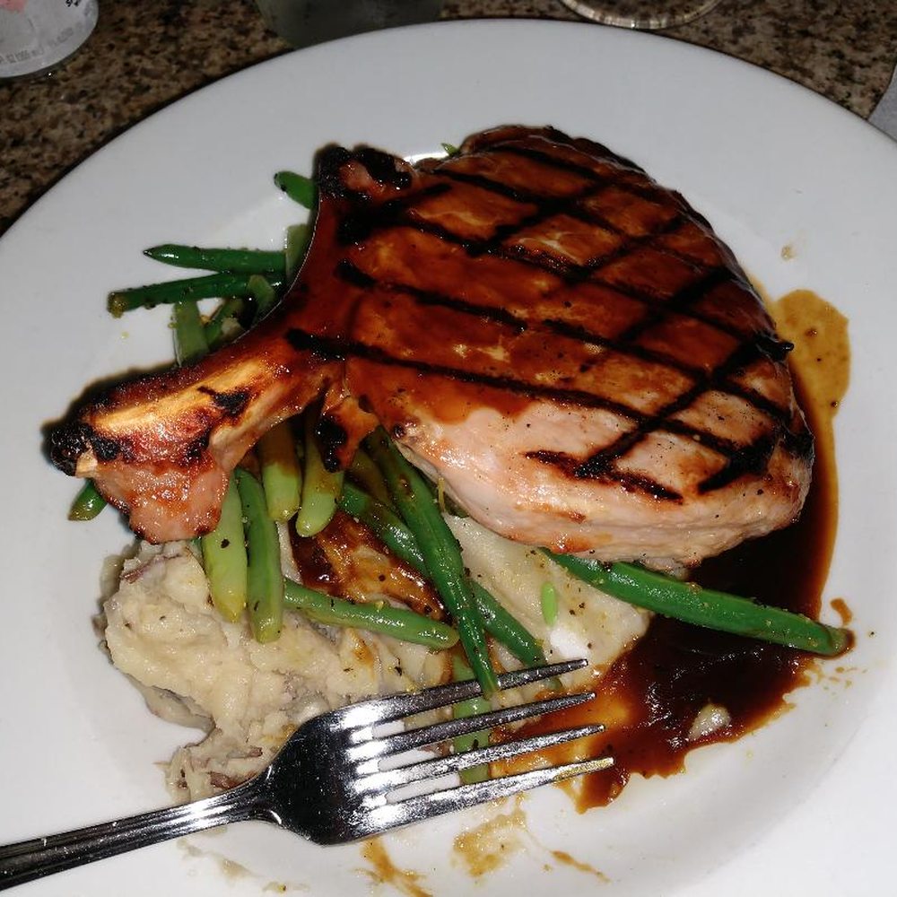 The Mansion - pork chop with garlic mashed potatoes, Gravy and green beans. - New American Near Me - Melbourne, Florida The Mansion - pork chop with garlic mashed potatoes, Gravy and green beans. - New American Near Me - Melbourne, Florida