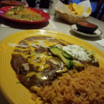 Carlos Restaurante - Mole Enchilada with rice and beans. - Mexican Near Me - Cave Junction, Oregon Carlos Restaurante - Mole Enchilada with rice and beans. - Mexican Near Me - Cave Junction, Oregon
