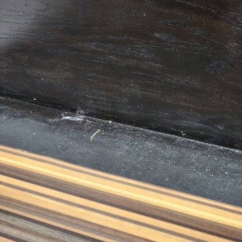 Luis Galindo's Latin American 2 - a closeup of a wood slat - Cuban Near Me - Miami, Florida