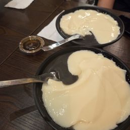 Hot tofu pudding with black sesame paste and ginger syrup