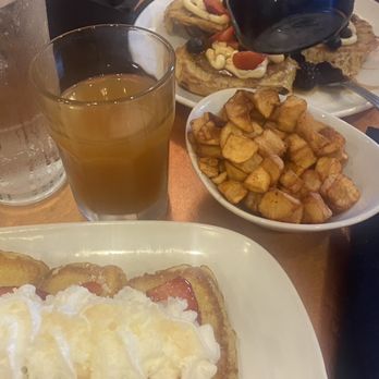 Another Broken Egg Cafe - Classic French Toast, glass of apple juice, Buttermilk Pancakes in background w Fresh Country Potatoes - Breakfast & Brunch Near Me - Madison, Alabama Another Broken Egg Cafe - Classic French Toast, glass of apple juice, Buttermilk Pancakes in background w Fresh Country Potatoes - Breakfast & Brunch Near Me - Madison, Alabama