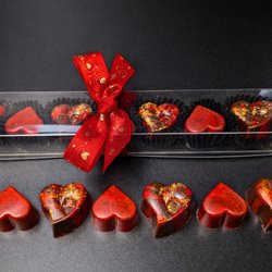 Sweet55 - Swiss Chocolates & Confections - Valentine's Day 2026: Seven Airbrushed Chocolate Hearts.
