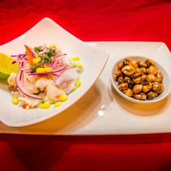 Solano's - Ceviche- fresh pieces of fish fillet marinated in squeezed lemon and lime juice, red onion, coriander and Peruvian chilli