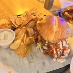 Lola’s Modern Kitchen - Buffalo Chicken Sandwich with kettle chips