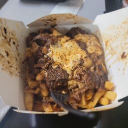Oxtail cheese fries! That's what got us in the door. We also ordered jerk chicken and pork. Delicious.  We will definitely be back.