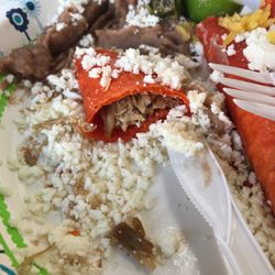 100% Antojitos Mexicanos - Beef enchiladas. Dried crumbled cheese and no enchilada sauce.